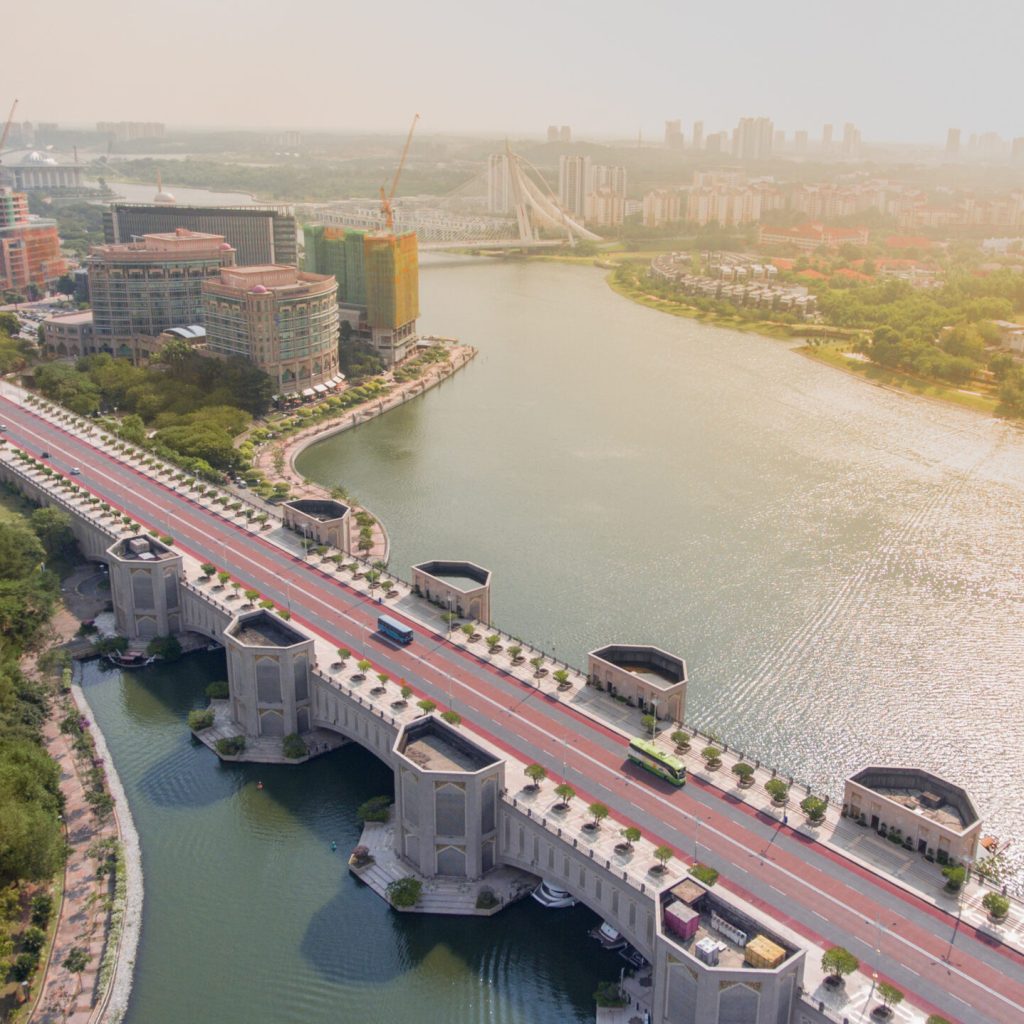 Drone shot of big bridge with unique architecture and lake in Putrajaya, Malaysia. Original public domain image from Wikimedia Commons